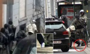 In this framegrab taken from VTM, something appears to drop from inside the trouser leg of Salah Abdeslam as he is arrested by police and bundled into a police vehicle during a raid in the Molenbeek neighborhood of Brussels, Belgium, Friday March 18, 2016. After an intense four-month manhunt across Europe and beyond, police on Friday captured Salah Abdeslam, the top suspect in last year's deadly Paris attacks, in the same Brussels neighborhood where he grew up. (VTM via AP) BELGIUM OUT